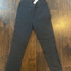 New York and co. Black and white polka dot slim fit pants.